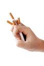 ManÃ¢â¬â¢s hand crushing cigarettes Royalty Free Stock Photo